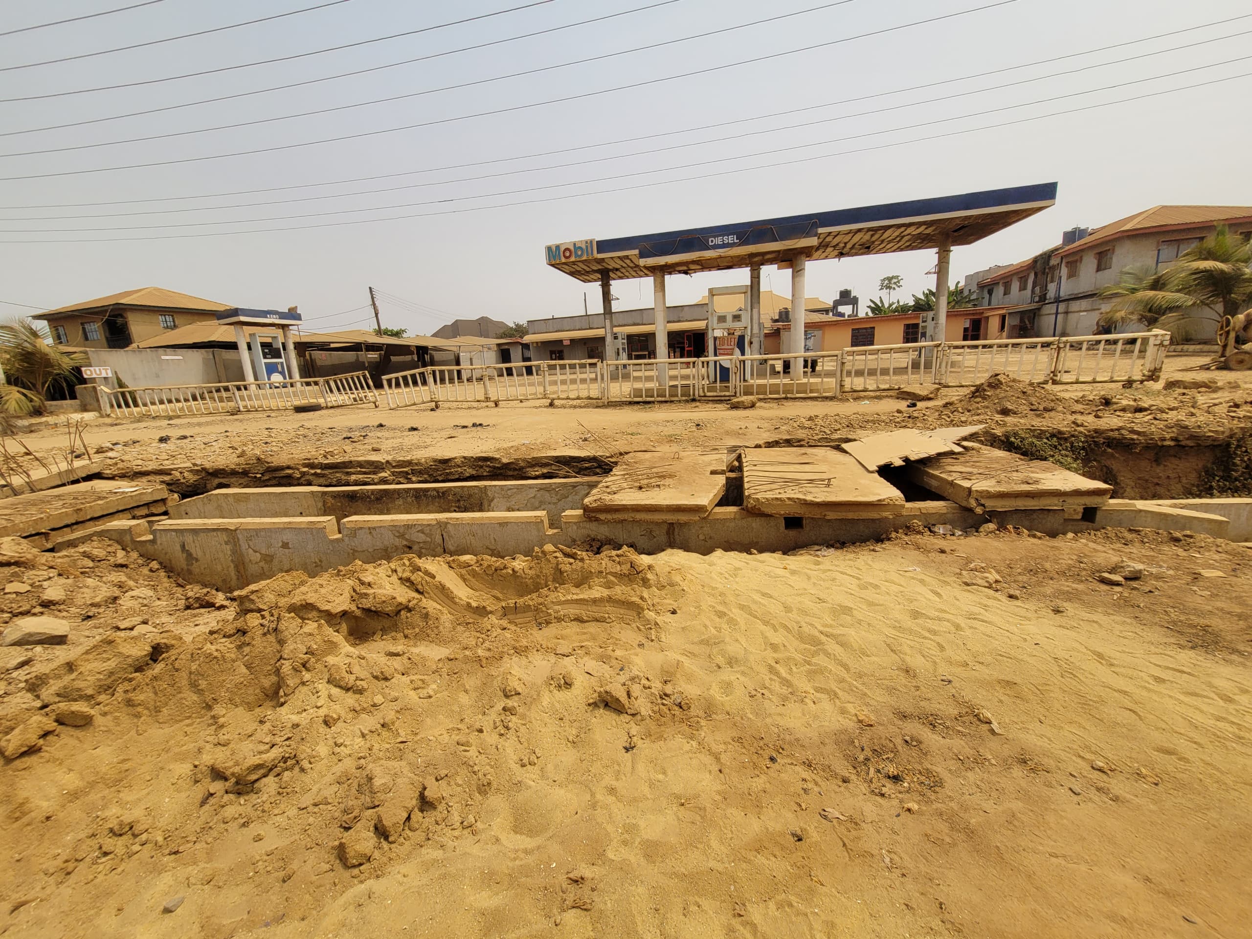 A filling station taken over by dust. Image Sodiq Ojuroungbe