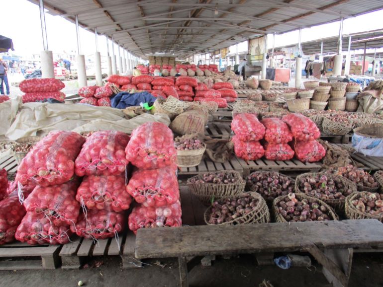Sacks of onions under sheds at the Adjen Kotoku Market in Accra Kent Mensah Al Jazeera 1694159308