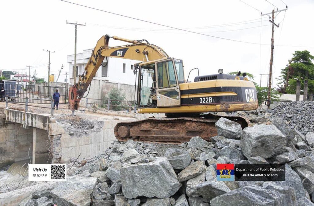 Unauthorized buildings along the banks of Tesa Dam and Legon Boundary Road are demolished by a post-flood mitigation task force